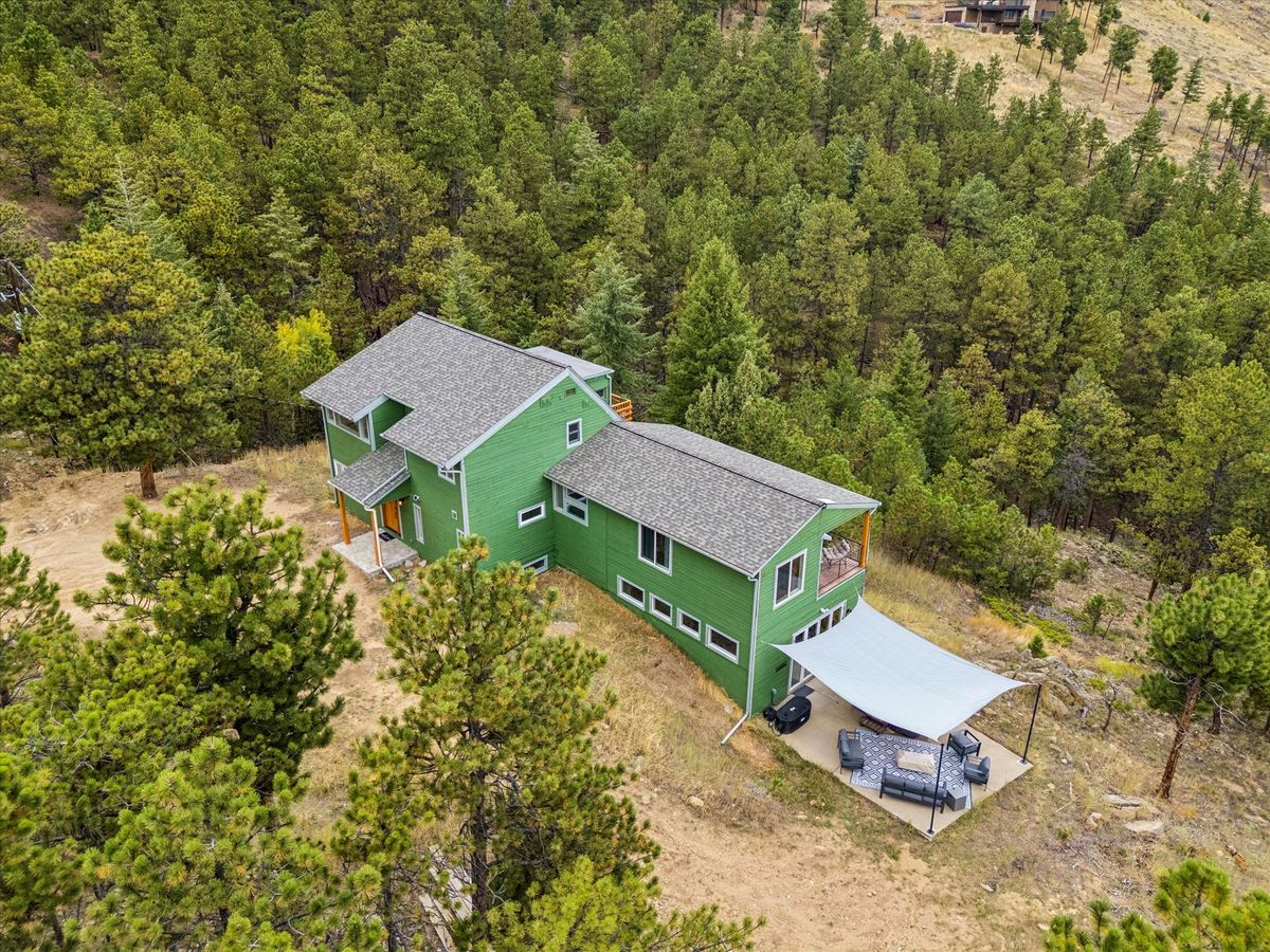 Aerial view of Sunshine Canyon Retreat and surrounding mountains