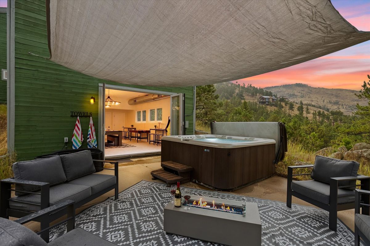 Hot tub with mountain views at Sunshine Canyon Retreat